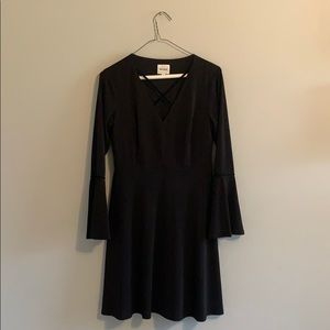 Black v neck dress with tapered sleeves